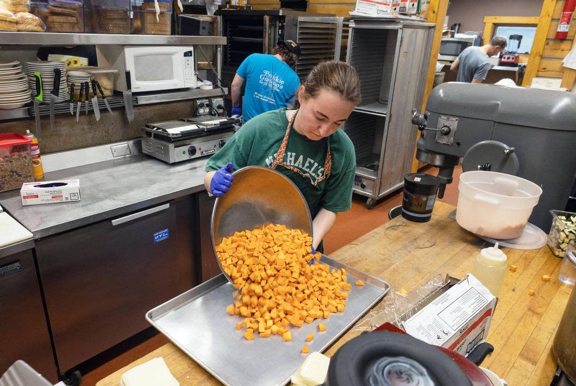 Diced sweet potatoes are placed on a tray as the employees of Stanley Baking Co. prepare to open the restaurant for breakfast in June.