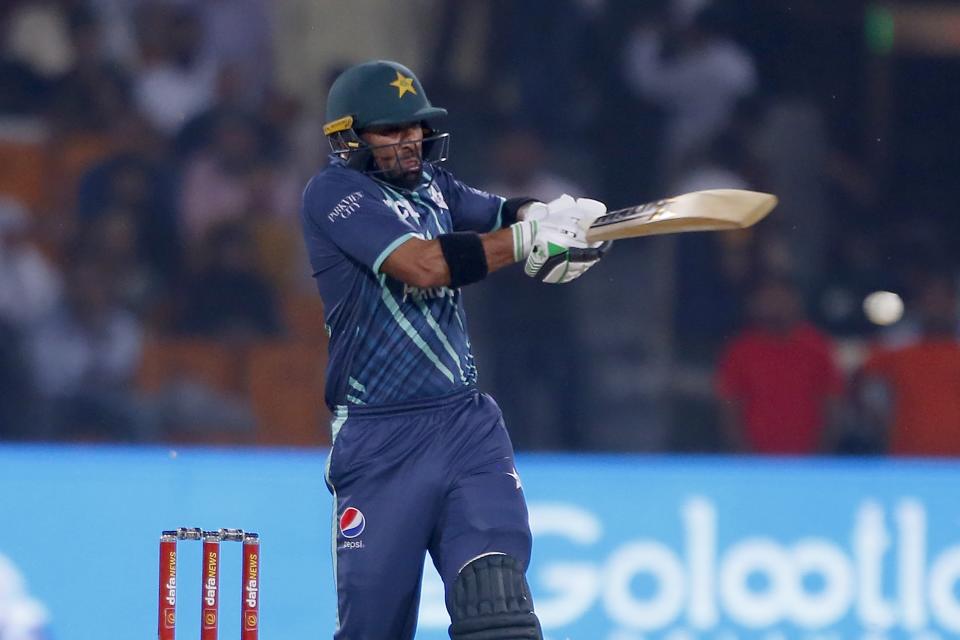 Pakistan's Iftikhar Ahmed plays a shot during the sixth twenty20 cricket match between Pakistan and England, in Lahore, Pakistan, Friday, Sept. 30, 2022. (AP Photo/K.M. Chaudary)