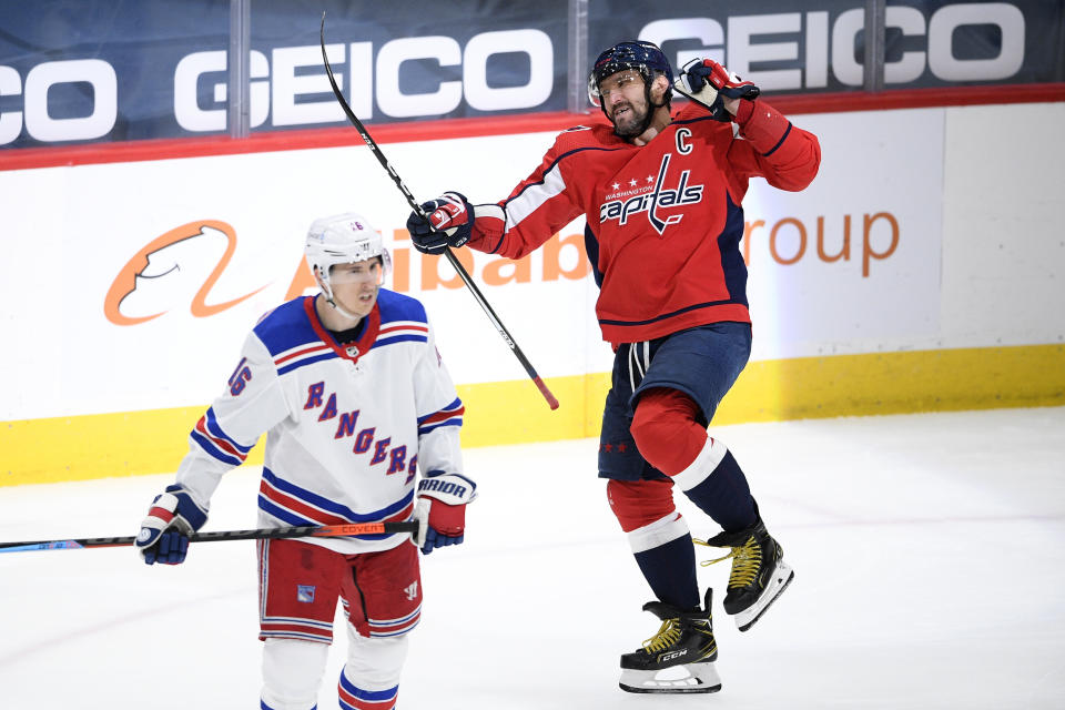 Washington Capitals left wing Alex Ovechkin, right, celebrates his goal next to New York Rangers center Ryan Strome (16) during the second period of an NHL hockey game, Sunday, March 28, 2021, in Washington. (AP Photo/Nick Wass)