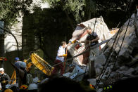 <p>Rescuers work at a collapsed building after an earthquake in Mexico City, Mexico September 19, 2017. REUTERS/Henry Romero </p>