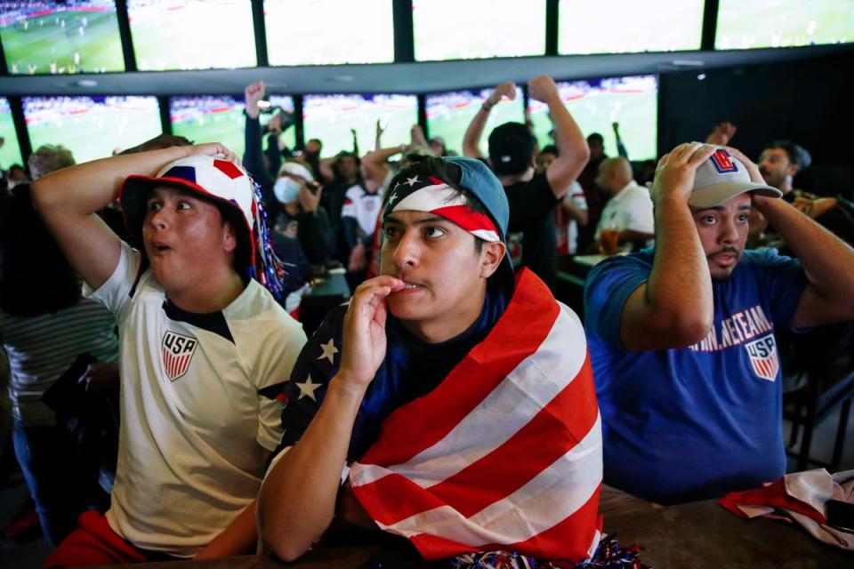 US fans react as Iran and the USA face off in the FIFA World Cup 2022 group B soccer match, at a bar in Los Angeles, California, USA, (EPA/CAROLINE BREHMAN)