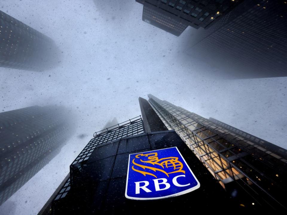  Snow falls around Royal Bank’s headquarters in Toronto.