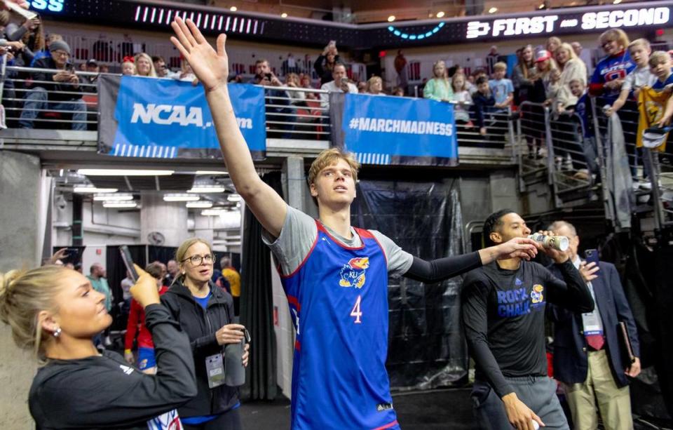 Kansas guard Gradey Dick (4) reaches out to high five fans before a team shoot around a day ahead of Kansas’ first round game against Howard in the NCAA college basketball tournament Wednesday, March 15, 2023, in Des Moines, Iowa.