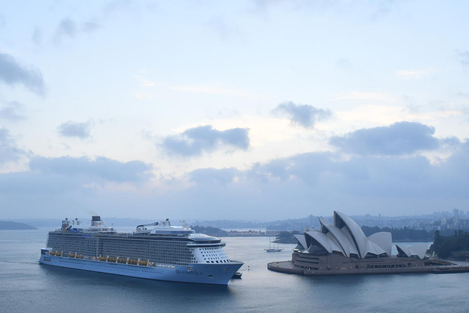 Pictured is the Ovation of the Seas vessel arriving in Sydney Harbour on Monday morning, sailing beyond the Sydney Opera House.