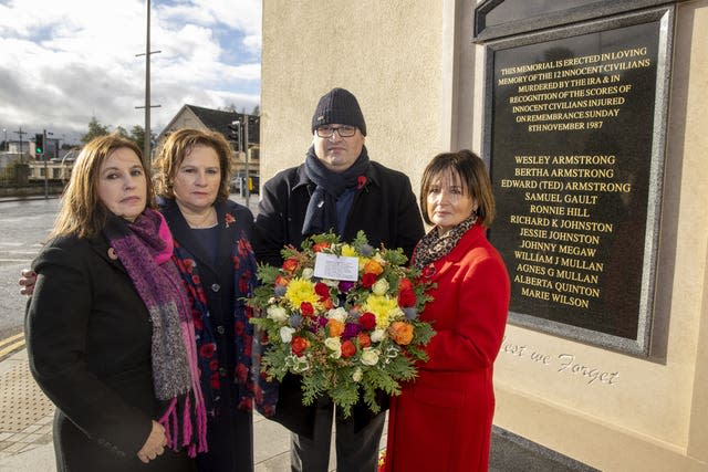The children of Wesley and Bertha Armstrong, from left, Moyna Nesbitt, Stella Robinson, Julian Armstrong and Pamela Whitley, take part in an act of remembrance to mark the 35th anniversary of the Enniskillen bomb