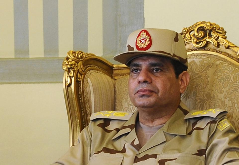 Egypt's Defense Minister Abdel Fattah al-Sisi is seen during a news conference in Cairo on the release of seven members of the Egyptian security forces kidnapped by Islamist militants in Sinai, in this May 22, 2013 file photo. Egyptian army chief General Abdel Fattah al-Sisi has been promoted to the rank of field marshal, the presidency said on January 27, 2014, fuelling speculation he is about to retire from the military and run for president. REUTERS/Stringer (EGYPT - Tags: MILITARY HEADSHOT POLITICS)