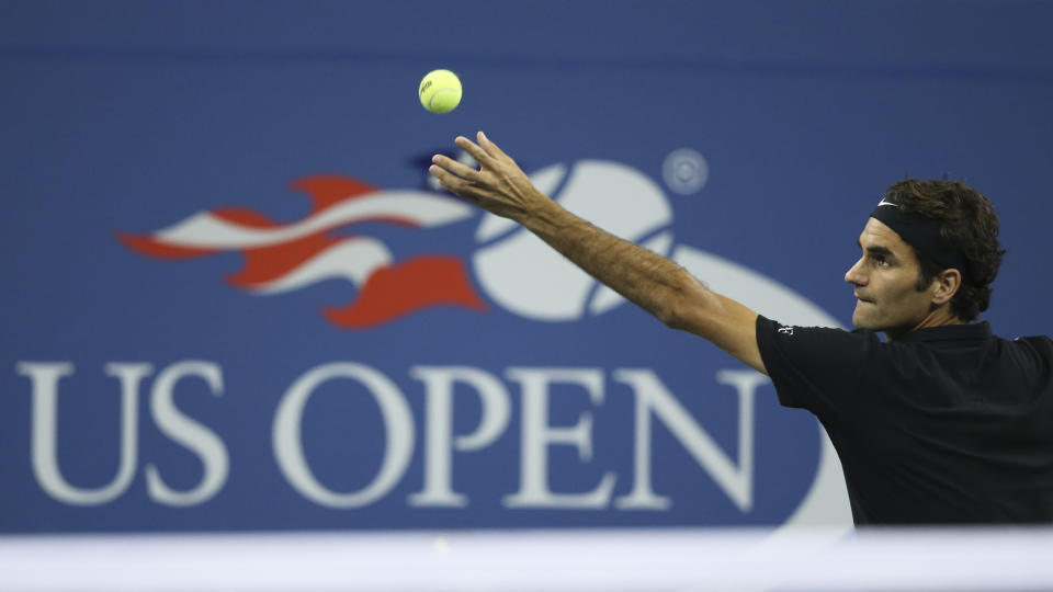 Roger Federer, serves to Gael Monfils during the quarterfinals of the U.S. Open tennis Sept. 4, 2014 (AP Photo/John Minchillo)