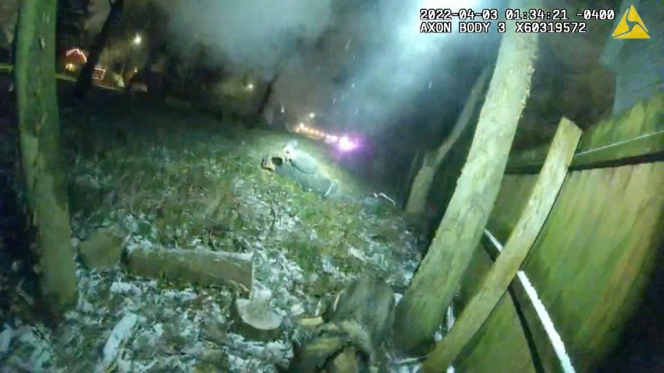 A man is seen in this still image from body camera video moments after being shot by Lenawee County Sheriff's Deputy Kirk June on April 3, 2022, in a vacant lot in the 500 block of Erie Street in Adrian.