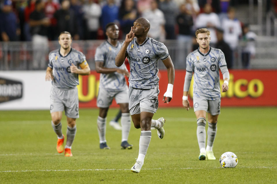 Montreal defender Kamal Miller (3) reacts to the crowd as he celebrates his goal during first half MLS soccer action against Toronto FC in Toronto on Sunday, Sept. 4, 2022. (Cole Burston/The Canadian Press via AP)