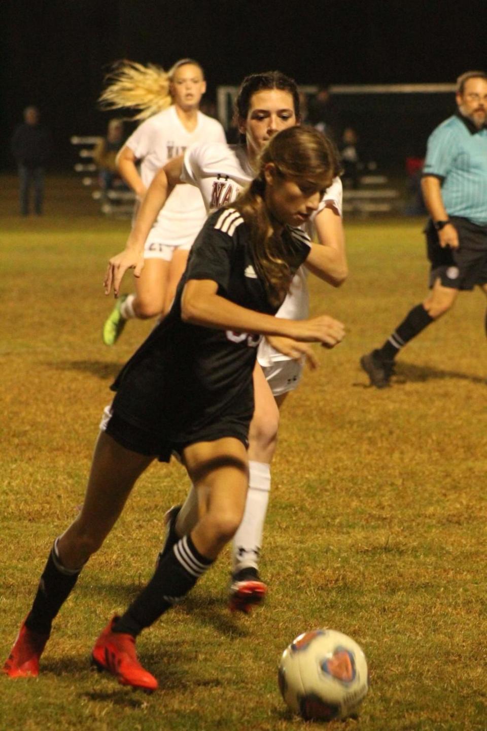 Sophia Edwards dribbles past a Navarre defender in a 1-0 win earlier this year.