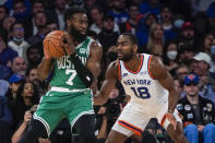 New York Knicks' Alec Burks (18) defends Boston Celtics' Jaylen Brown (7) during the first half of an NBA basketball game Wednesday, Oct. 20, 2021 in New York. (AP Photo/Frank Franklin II)