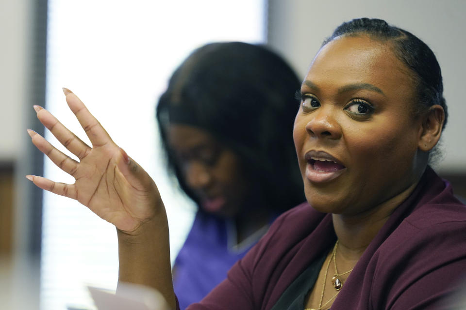 Arekia Bennett-Scott, 30, executive director of Mississippi Votes, discusses elections, race and voter fatigue, with young student and community social activists, Oct. 25, 2023, in Jackson, Miss. (AP Photo/Rogelio V. Solis)