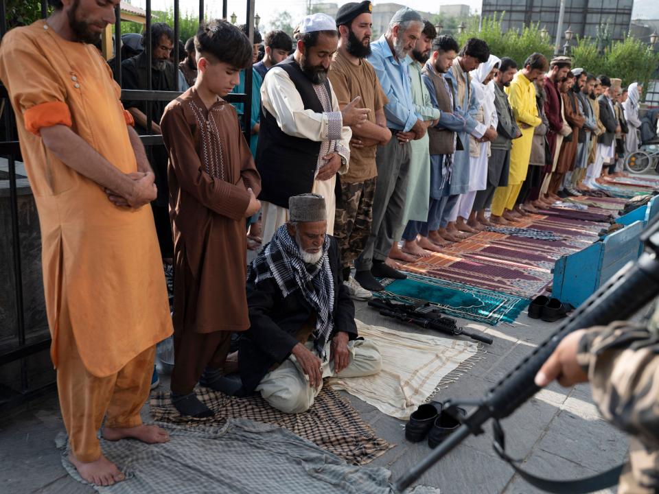 Afghan Muslim devotees offer their Eid al-Adha prayers at Shah-e-Do Shamshira mosque in Kabul on July 9, 2022.