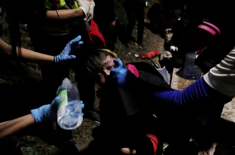 A protester receives medical attention during a standoff with riot police at the Chinese University of Hong Kong