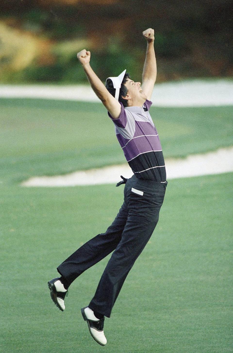 Larry Mize of Columbus jumps in the air after making the winning shot in a sudden death playoff to win the Masters Golf title in April 12, 1987 in Augusta.