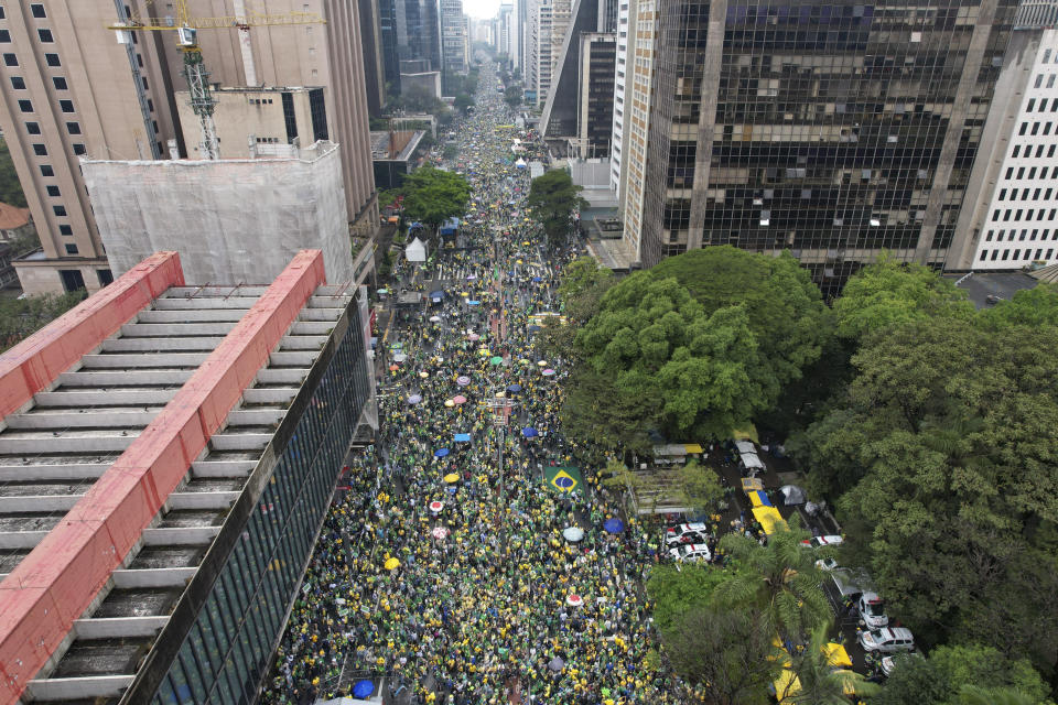 Supporters of Brazilian President Jair Bolsonaro, who is running for a second term, attend a demonstration to celebrate the bicentennial of the country's independence in Sao Paulo, Brazil, Wednesday, Sept. 7, 2022. (AP Photo/Andre Penner)