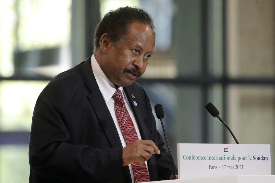 FILE - Sudanese Prime Minister Abdalla Hamdok speaks during a session of the summit to support Sudan, May 17, 2021 at the Grand Palais Ephemere in Paris. The reinstatement of Sudan's prime minister after weeks under house arrest was the biggest concession made by the military since its Oct. 25 coup but leaves the country's transition to democracy mired in crisis. The military reached a deal with Abdalla Hamdok on Sunday, Nov. 21, 2021 that would restore him as the head of a new technocratic Cabinet ahead of eventual elections. (AP Photo/Christophe Ena, Pool, File)