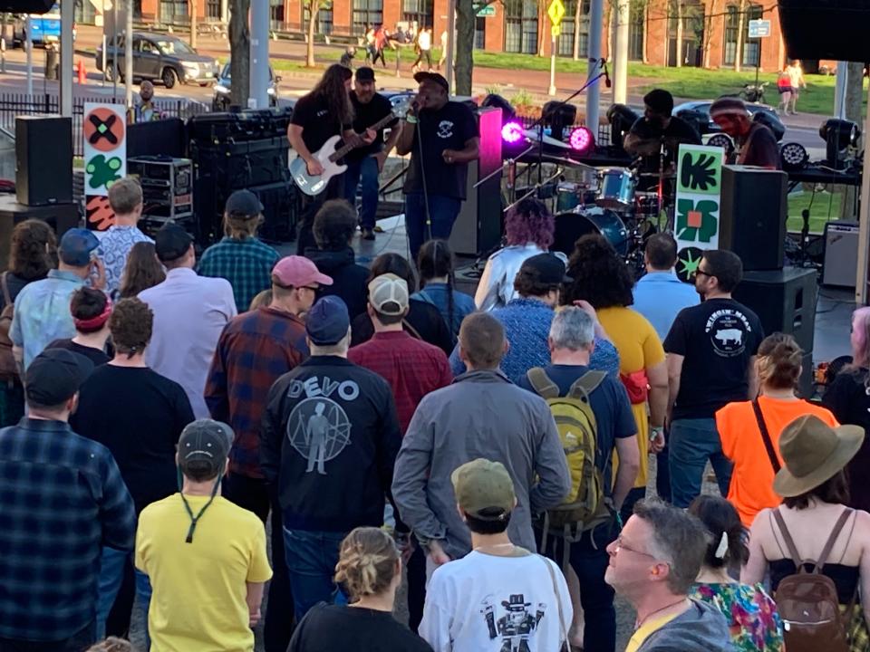 A crowd gathers to listen to Rough Francis perform May 6, 2023 at the Waking Windows festival in Winooski.