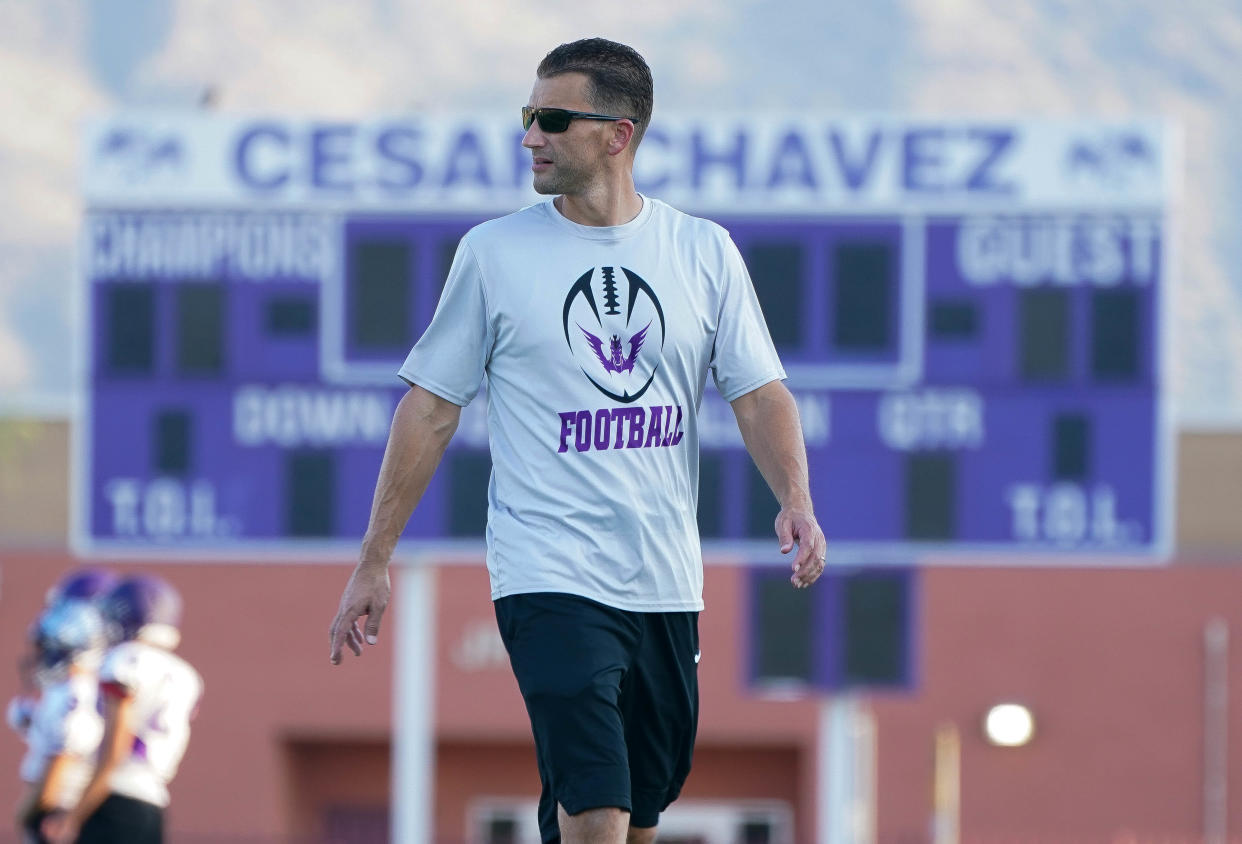 Cesar Chavez head coach William Chipley keeps an eye on his team during a practice at Cesar Chavez High School Sept, 15, 2021.