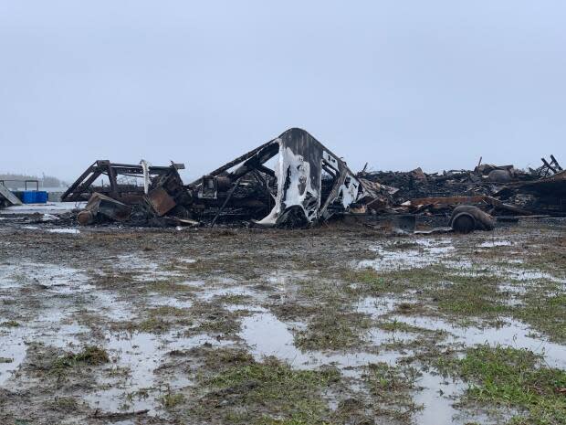 A lobster pound burned to the ground in Middle West Pubnico, N.S., in October.  (Taryn Grant/CBC - image credit)