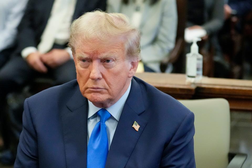 Former President Donald Trump, right, sits in the courtroom at New York Supreme Court on Oct. 2, 2023, in New York. Trump is making a rare, voluntary trip to court in New York for the start of a civil trial in a lawsuit that already has resulted in a judge ruling that he committed fraud in his business dealings.