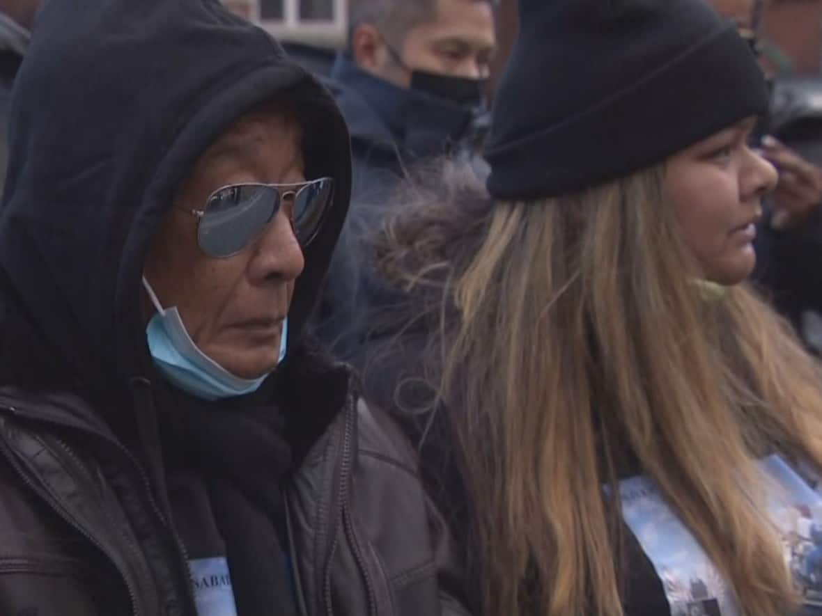 Relatives of Oliver Sabater attend a ceremony in his honour on Saturday where a memorial was created for him on Parkside Drive, where he was killed in a motorcycle collision in 2018. His sister Leni-Jayne Tang is far left, while his daughter Jessica Sabater is far right. (CBC - image credit)