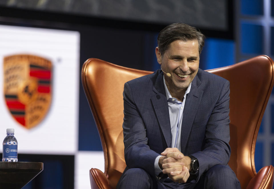 Klaus Zellmer, president and CEO Porsche Cars North America, smiles during a panel called "Racing The Future: How Porsche Sees The Road Ahead," at the AutoMobility LA Auto Show in Los Angeles, Tuesday, Nov. 19, 2019. (AP Photo/Damian Dovarganes)