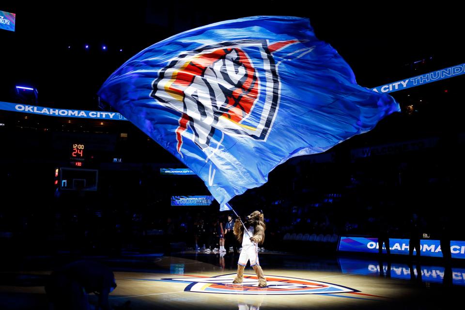 Rumble the Bison waves a Thunder flag before an NBA preseason game between OKC and the Adelaide 36ers at Paycom Center on Oct. 6.