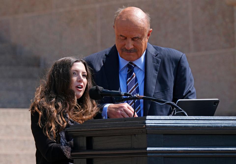 Lea Glossip and Phil McGraw address the crowd Tuesday during a Justice Rally for Richard Glossip at the state Capitol.