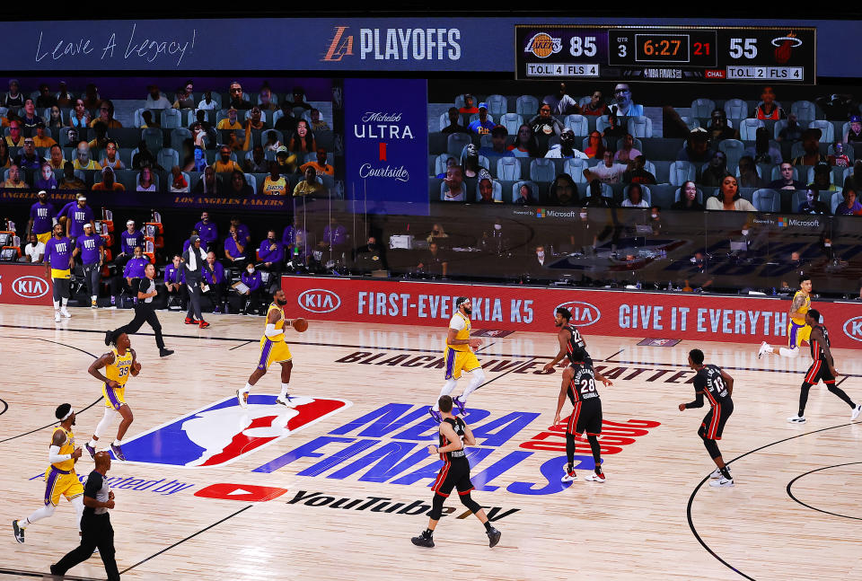 LAKE BUENA VISTA, FLORIDA - SEPTEMBER 30: The Los Angeles Lakers and the Miami Heat in action during the third quarter in Game One of the 2020 NBA Finals  at AdventHealth Arena at the ESPN Wide World Of Sports Complex on September 30, 2020 in Lake Buena Vista, Florida. NOTE TO USER: User expressly acknowledges and agrees that, by downloading and or using this photograph, User is consenting to the terms and conditions of the Getty Images License Agreement.  (Photo by Kevin C. Cox/Getty Images)