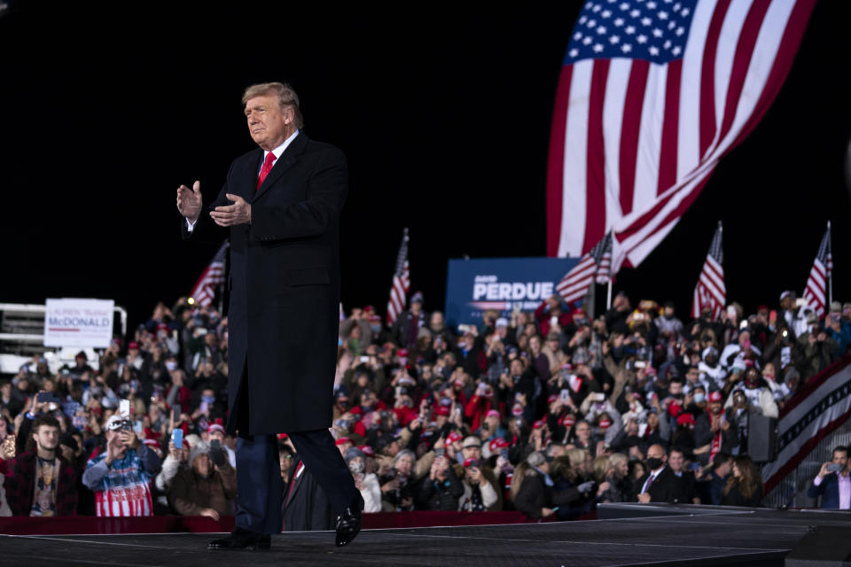 FILE - In this Jan. 4, 2021 file photo, President Donald Trump arrives to speak at a campaign rally for Sen. Kelly Loeffler, R-Ga., and David Perdue at Dalton Regional Airport, in Dalton, Ga. The rewards of an early Donald Trump endorsement will be on display Saturday, Sept. 25 in Georgia. A three-man ticket of candidates he’s backing in 2022 Republican primaries for statewide office will take the stage with him. (AP Photo/Evan Vucci)