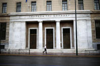 A man walks past the headquarters of the Central Bank of Greece in Athens, Greece, November 8, 2016. Picture taken November 8, 2016. REUTERS/Alkis Konstantinidis