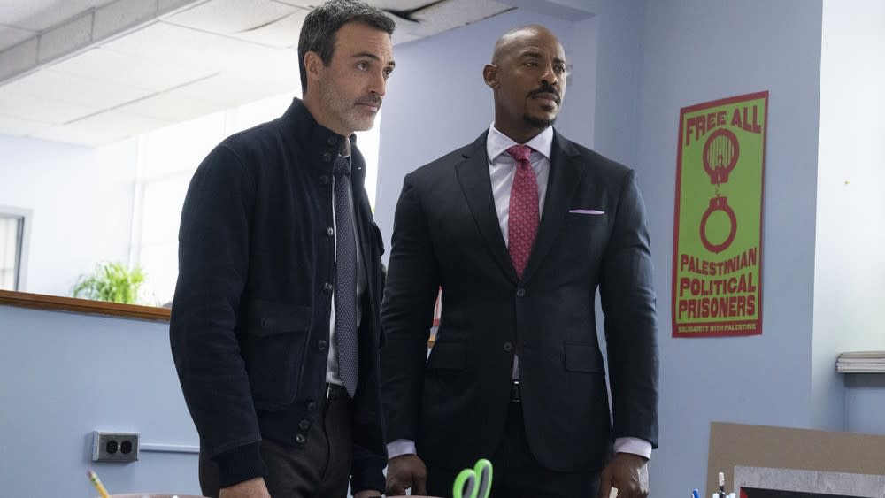  Reid Scott as Det. Vincent Riley and Mehcad Brooks as Det. Jalen Shaw in an office in Law & Order season 23. 