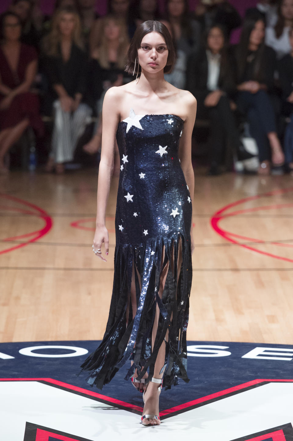 <p><i>Models wears a patriotic, star-sequined dress with fringes from the SS18 Monse collection. (Photo: IMAXtree) </i></p>