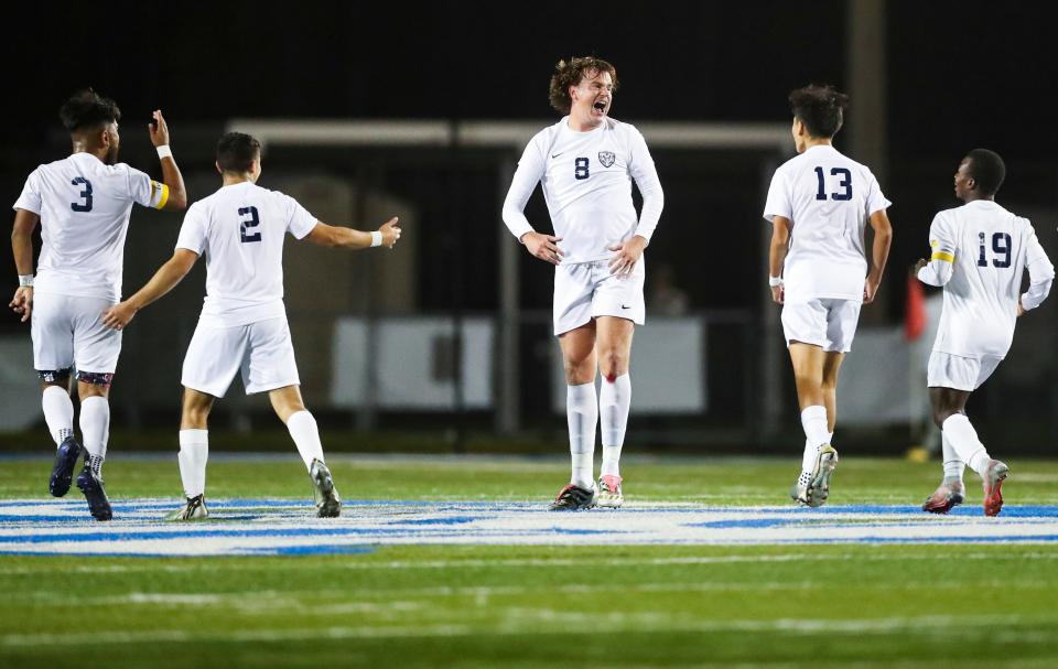 Naples Golden Eagles midfielder Oliver Ditheridge (8) celebrates with his teammates after scoring his fourth goal during the second half of the Class 5A regional final against the Barron Collier Cougars at Barron Collier High School in Naples on Wednesday, Feb. 21, 2024.