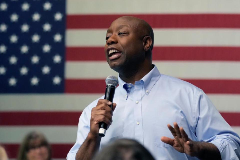 Tim Scott in front of an American flag