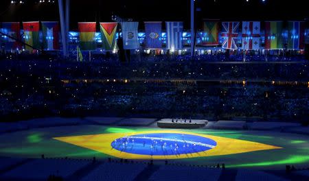 2016 Rio Olympics - Closing Ceremony - Maracana - Rio de Janeiro, Brazil - 21/08/2016. The Brazilian national flag is seen projected on the stage as children sing the Brazilian national anthem. REUTERS/Yves Herman