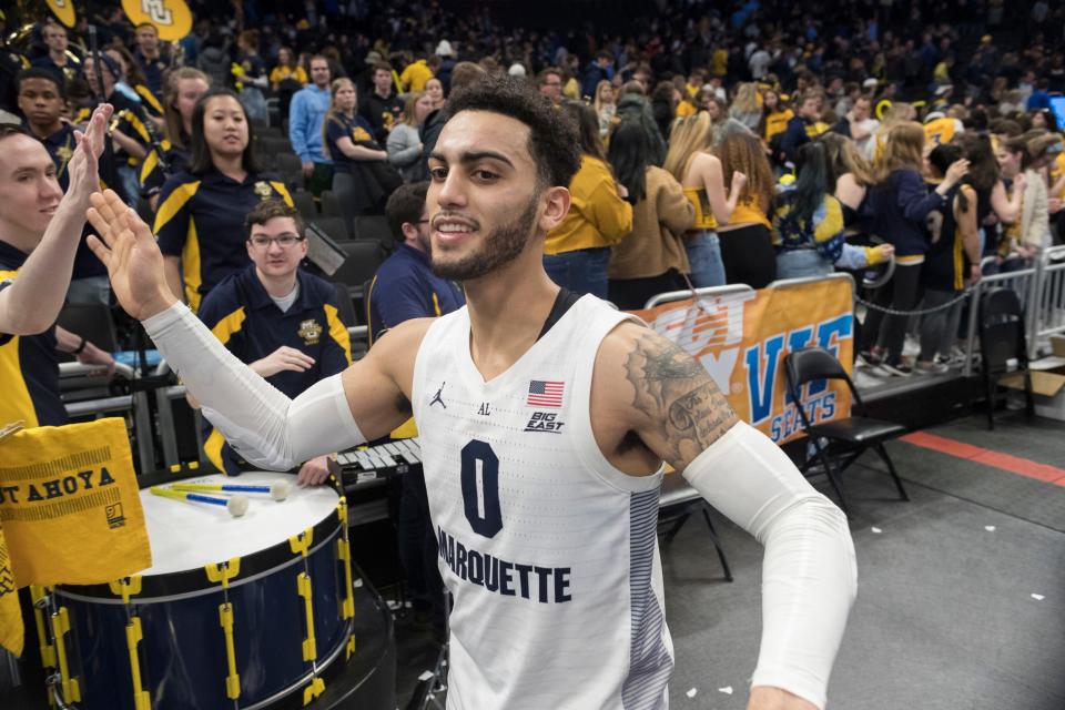 Marquette guard Markus Howard high-fives fans after game Feb. 1, 2020, at Fiserv Forum.