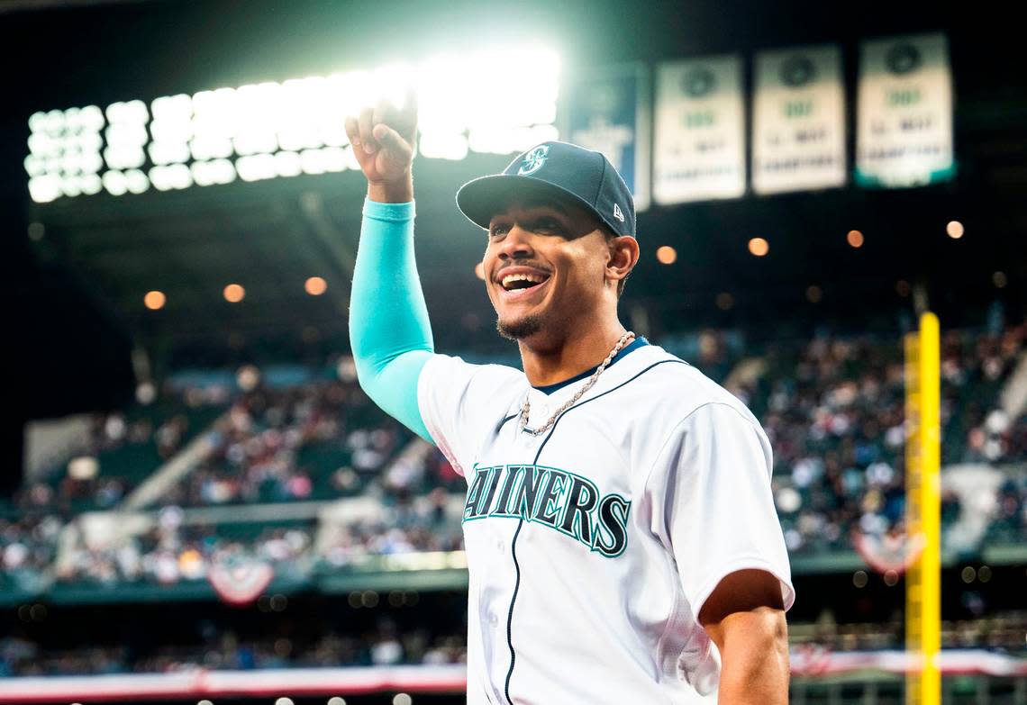 Seattle Mariners center fielder Julio Rodriguez (44) walks onto the field to accept the Silver Slugger and AL Rookie of the Year awards during the opening ceremony before the start of the Mariners home opener against the Cleveland Guardians at T-Mobile Park in Seattle on Thursday, March 30, 2023. Cheyenne Boone/Cheyenne Boone/The News Tribune