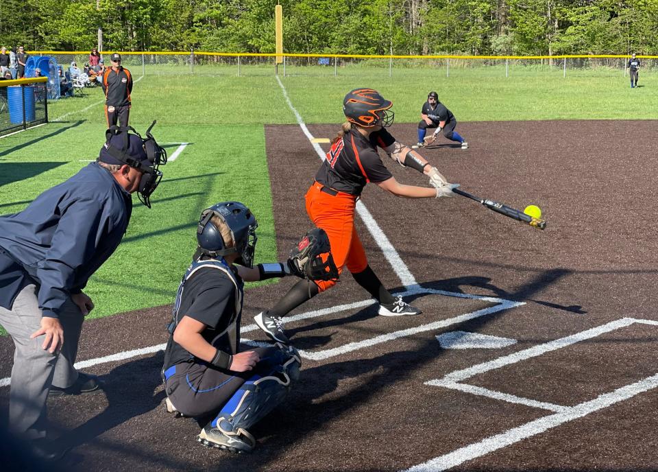 Harbor Creek's Rylee Vogt hits a single one at-bat after she hit a grand slam against Seneca on Monday at Seneca High School's field. Seneca won 8-7.