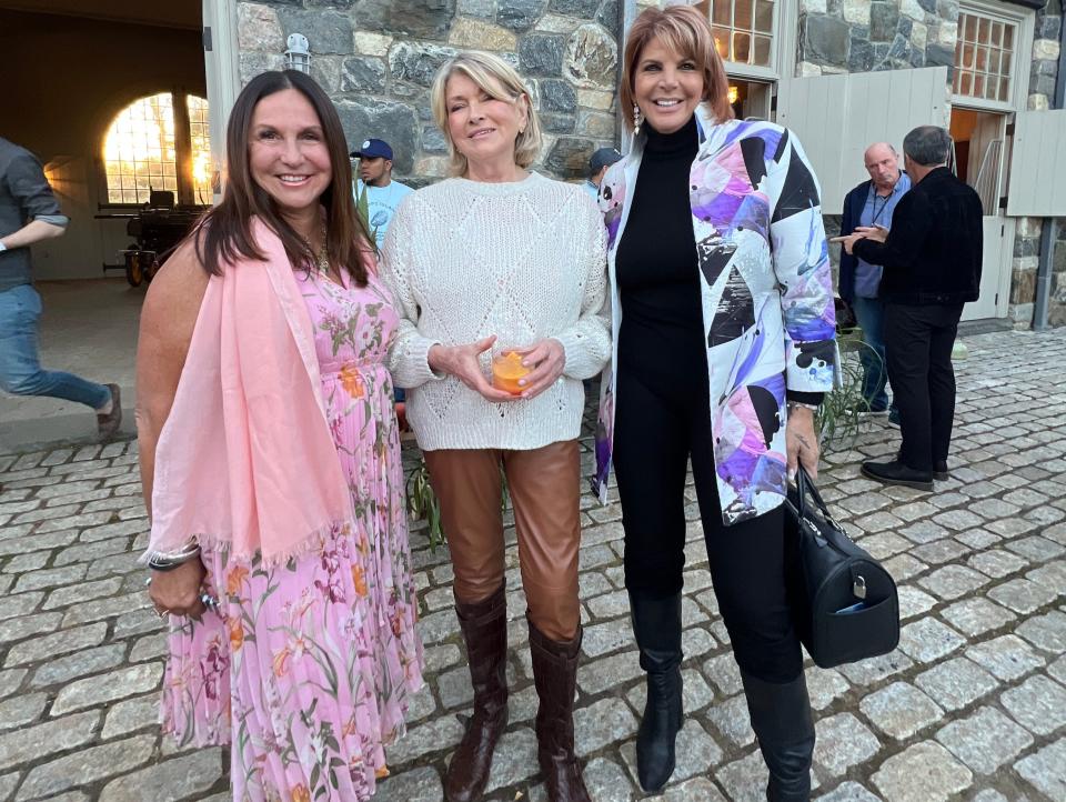 Blogger Stacy Geisinger and friend, Marcie Manfredonia, flank Martha Stewart during the cocktail party preview at Stewart's Westchester estate.