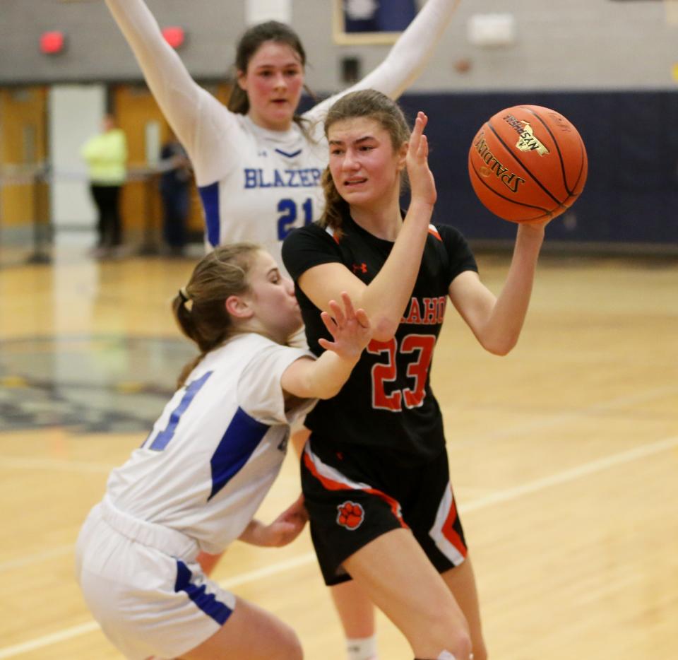 Tuckahoe's Chloe Angello looks to pass away from Millbrook's Lilly Kozera during the New York State Class C regional final on March 7, 2024.