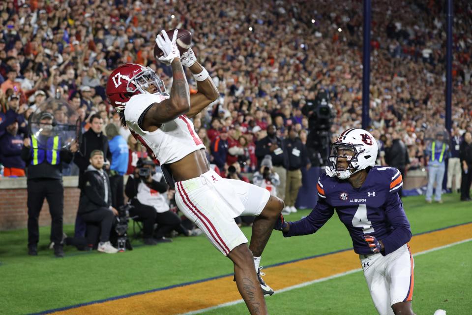 Alabama wide receiver Isaiah Bond catches the game-winning touchdown against Auburn.