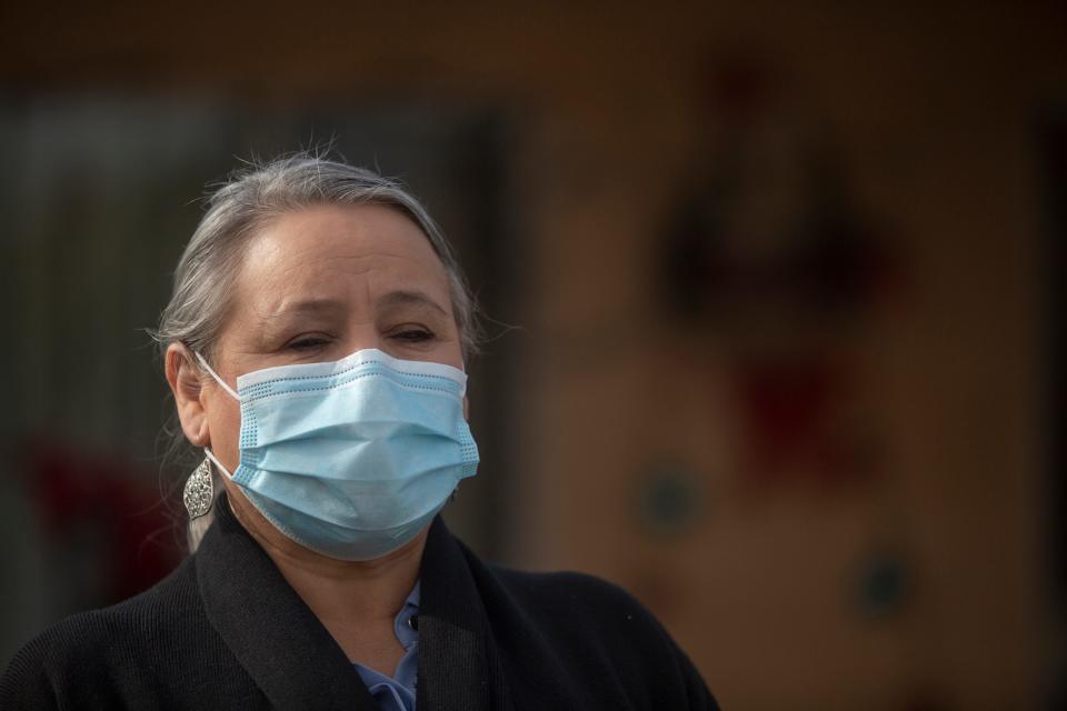 Maria Mendez had to suspend her annual plans of visiting family in her native Mexico after contracting COVID-19. She is photographed outside her home in Mecca as she quarantines in December. 