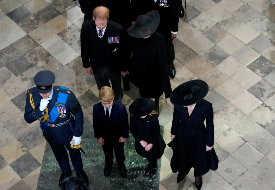 The couple appear to clasp hands as they follow the Prince and Princess of Wales and their children out of Westminster Abbey. (Getty Images)