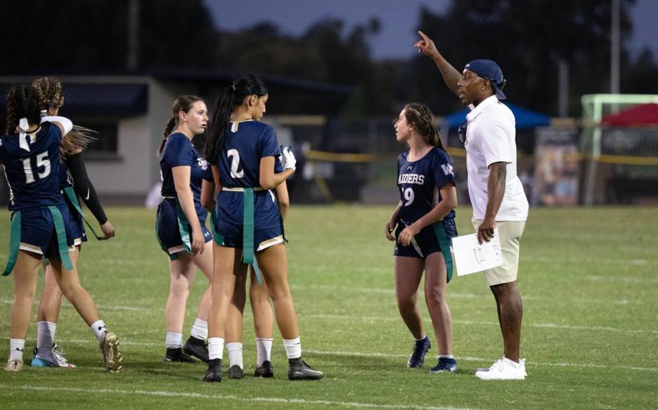 Central Catholic coach Brett Butler talks with his players between possessions during the flag football game between Central Valley and Central Catholic at Central Catholic High School in Modesto , Calif., Thursday, August 24, 2023.