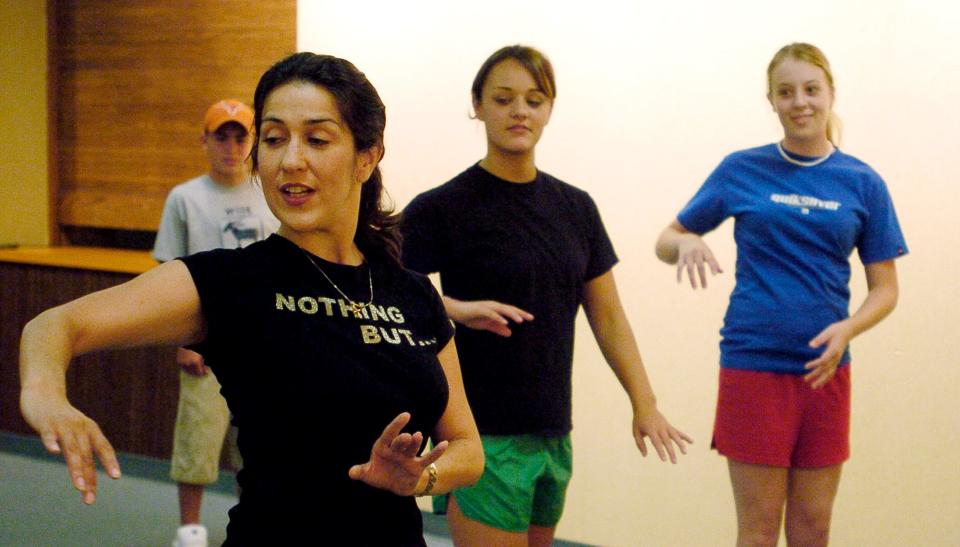 Shannon Calderon teaches a salsa dance class at the Purcell Public Library Tuesday, June 22,  2004. A beloved dancer and teacher, Shannon Calderón Primeau died of cancer in 2015 at the age of 45.