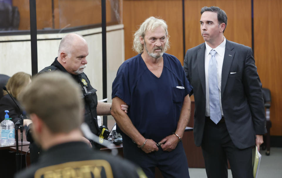 FILE - Curtis Edward Smith is escorted out of Richland County Bond court with his attorney, Jarrett Bouchette on June, 28, 2022, in Columbia, S.C. Smith was charged with two counts of conspiracy, four counts of money laundering, three counts of forgery and multiple drug related charges. (Tracy Glantz/The State via AP, File)