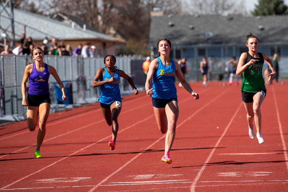 Timnath's Emili Voelker takes the lead in her 100-meter dash race during the Randy Yaussi PSD city championship track and field meet on April 9 at French Field in Fort Collins.