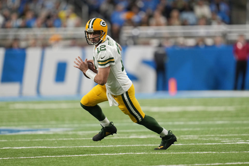 FILE - Green Bay Packers quarterback Aaron Rodgers scrambles during the first half of an NFL football game against the Detroit Lions, Nov. 6, 2022, in Detroit. Rodgers is leaving behind his brilliant legacy in Green Bay and heading to the bright lights — and massive expectations — of the Big Apple. The New York Jets agreed on a deal Monday, April 24, 2023, to acquire the four-time NFL MVP from the Packers, according to a person with knowledge of the trade. The person spoke to The Associated Press on the condition of anonymity because the teams have not officially announced the deal. (AP Photo/Paul Sancya, File)